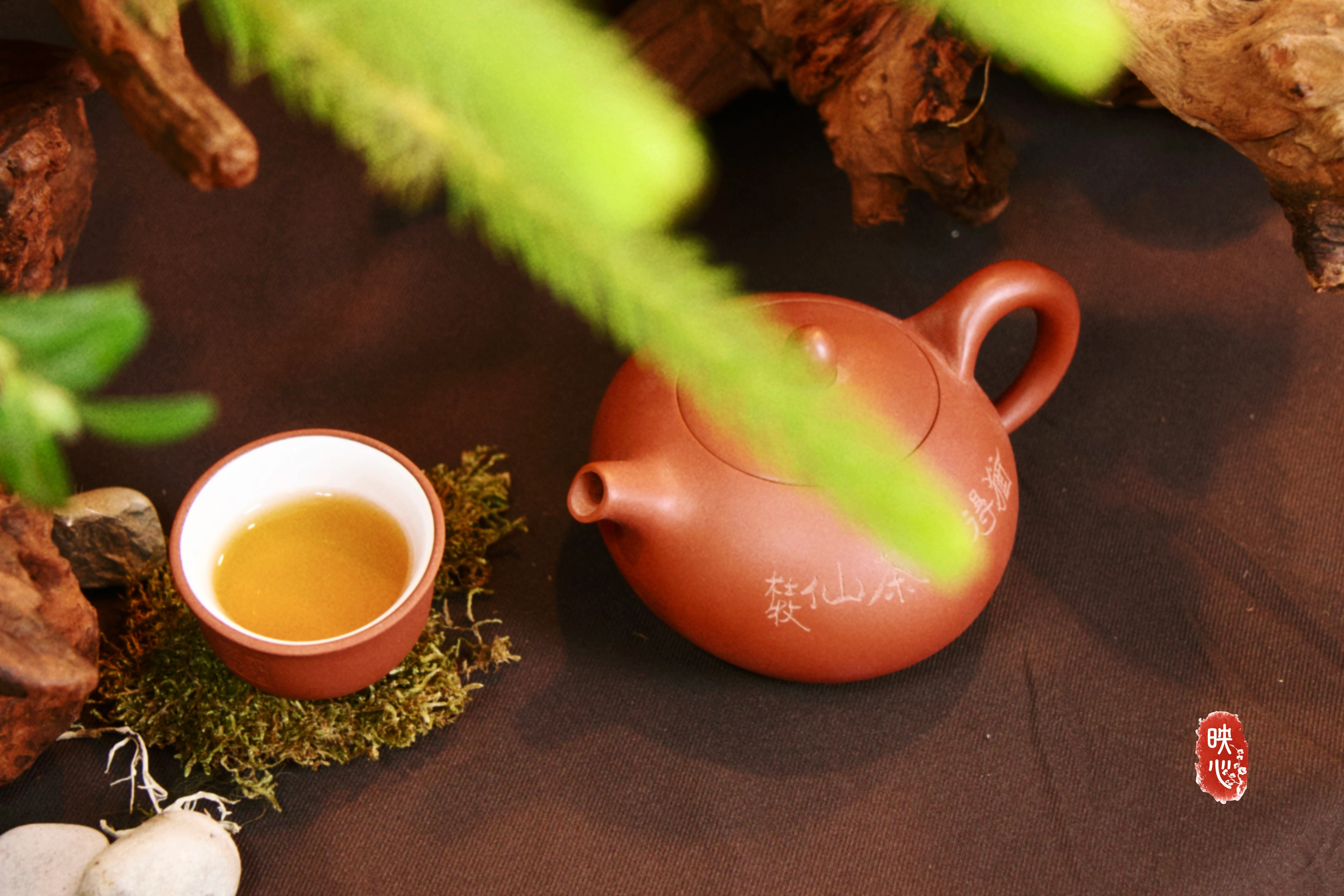 Tea ceremony setting with teapot and cups