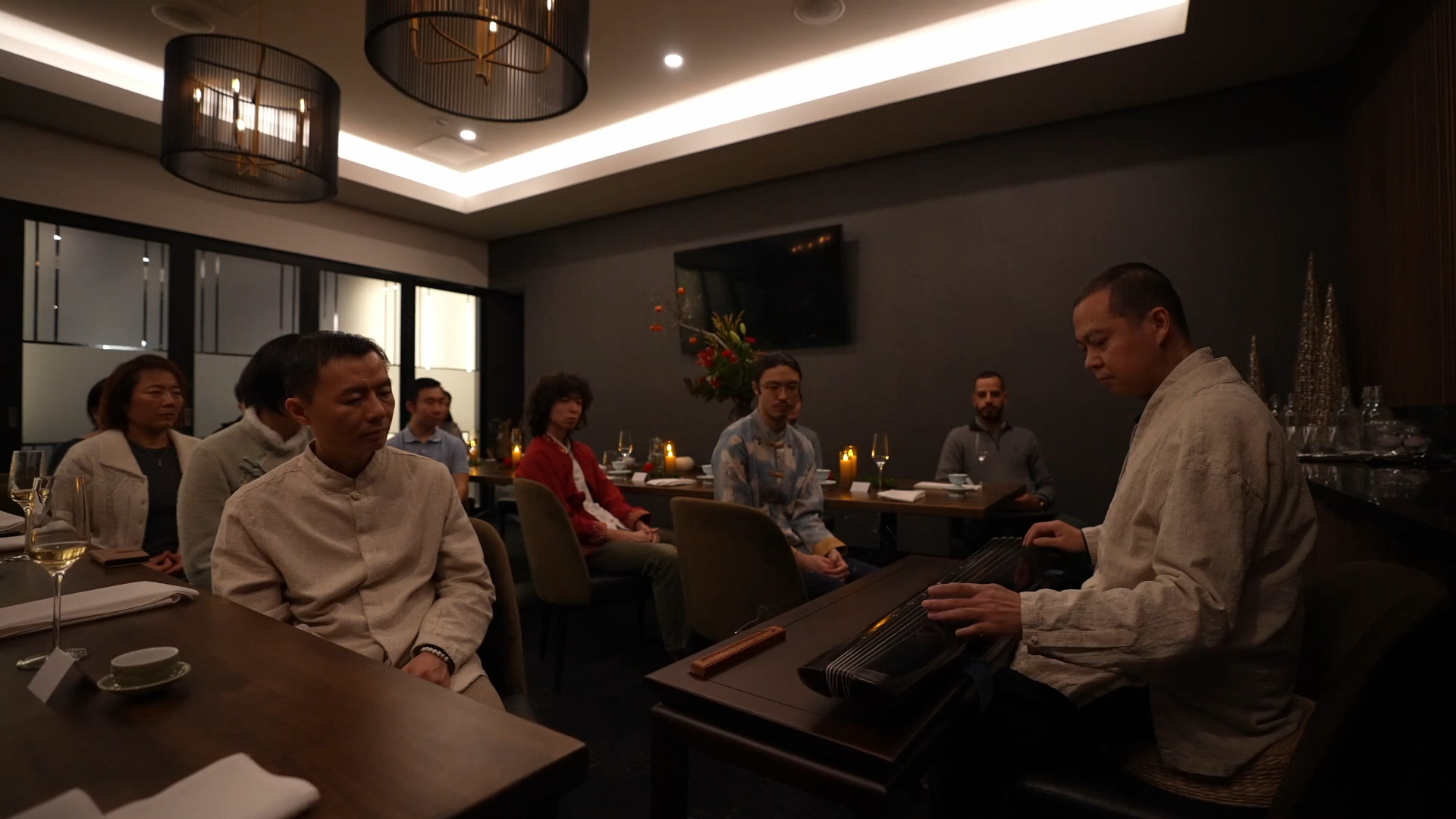 Community gathering around tea and the arts